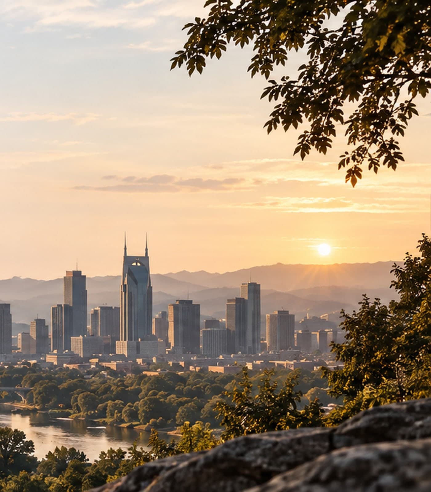 Wooded hills overlooking the Nashville skyline at golden hour.